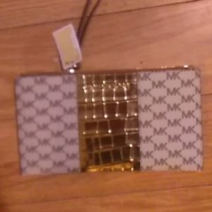 Michael kors center stripe LG zip clutch